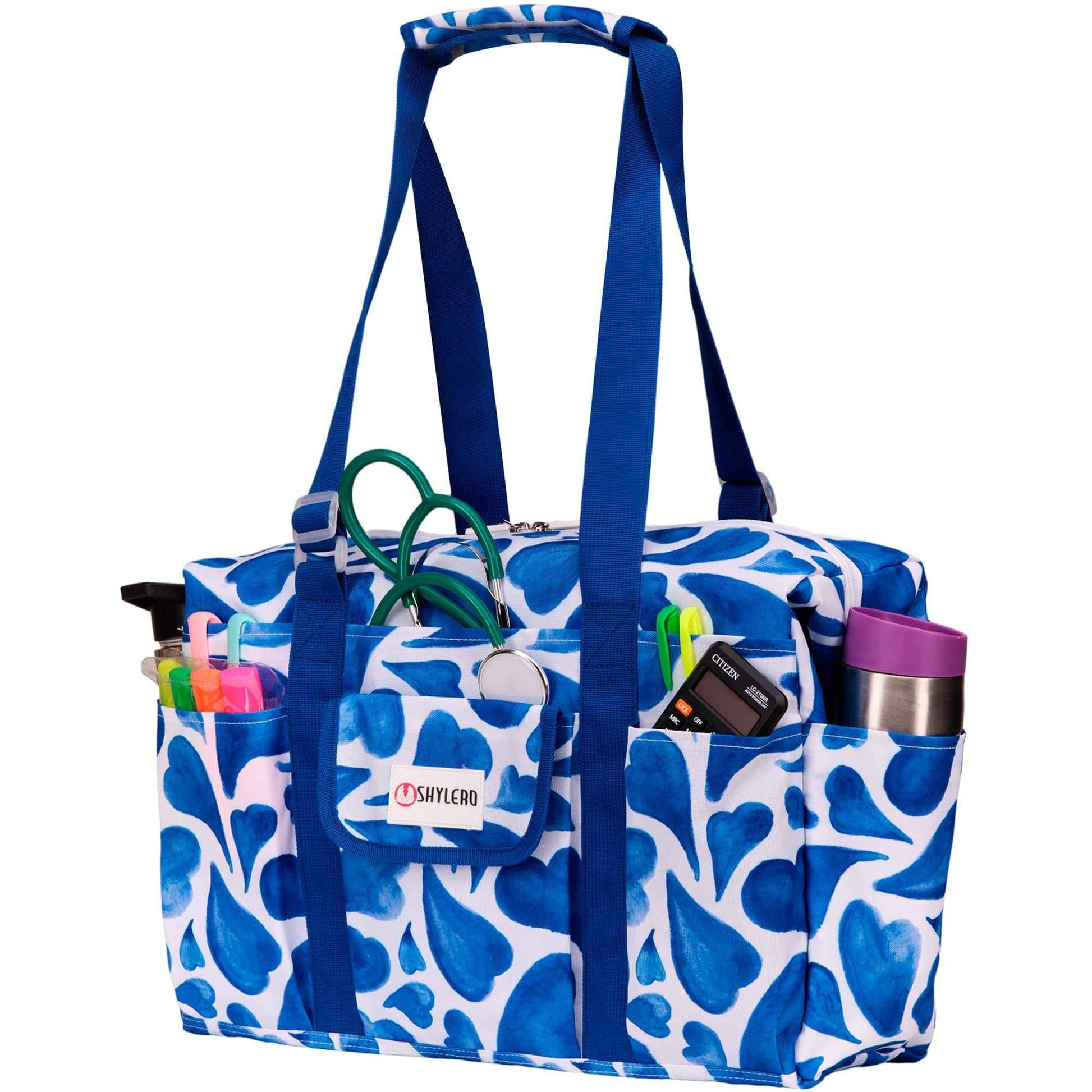 Nurse Bag and Utility Tote | Waterproof | Blue HeartsGrab Your Large SHYLERO Utility Bag and Enjoy: 

 * 14 OUTSIDE POCKETS 
 * 7 INSIDE POCKETS 
 * DEDICATED LAPTOP COMPARTMENT (UP TO 17") 
 * LARGE &amp; ROOMY - sizetoteNurse BagSHYLEROScrub Angel & Accessories 