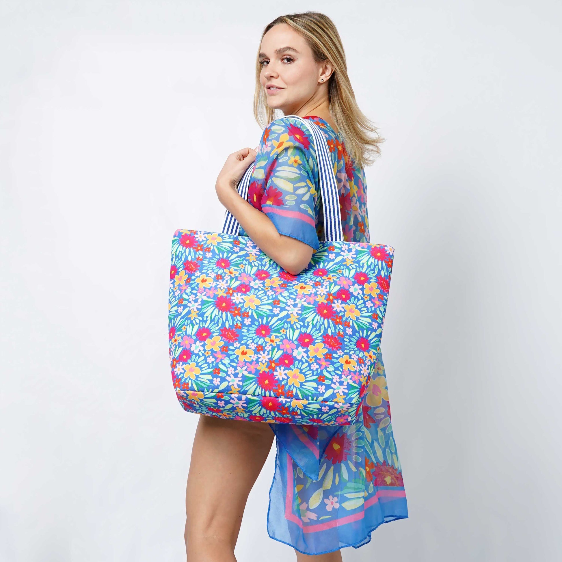 Colorful Floral Print Summer Tote BagFloral Print Tote Bag 

- Zipper Closure
- One Small Zipped Pocket Inside
- Size: 15.25" L x 19" W (5.5" Wide Bottom)
- 100% Polyester

**Light Weight, Perfect for SColorful Floral Print Summer Tote BagFashion CityScrub Angel & Accessories 