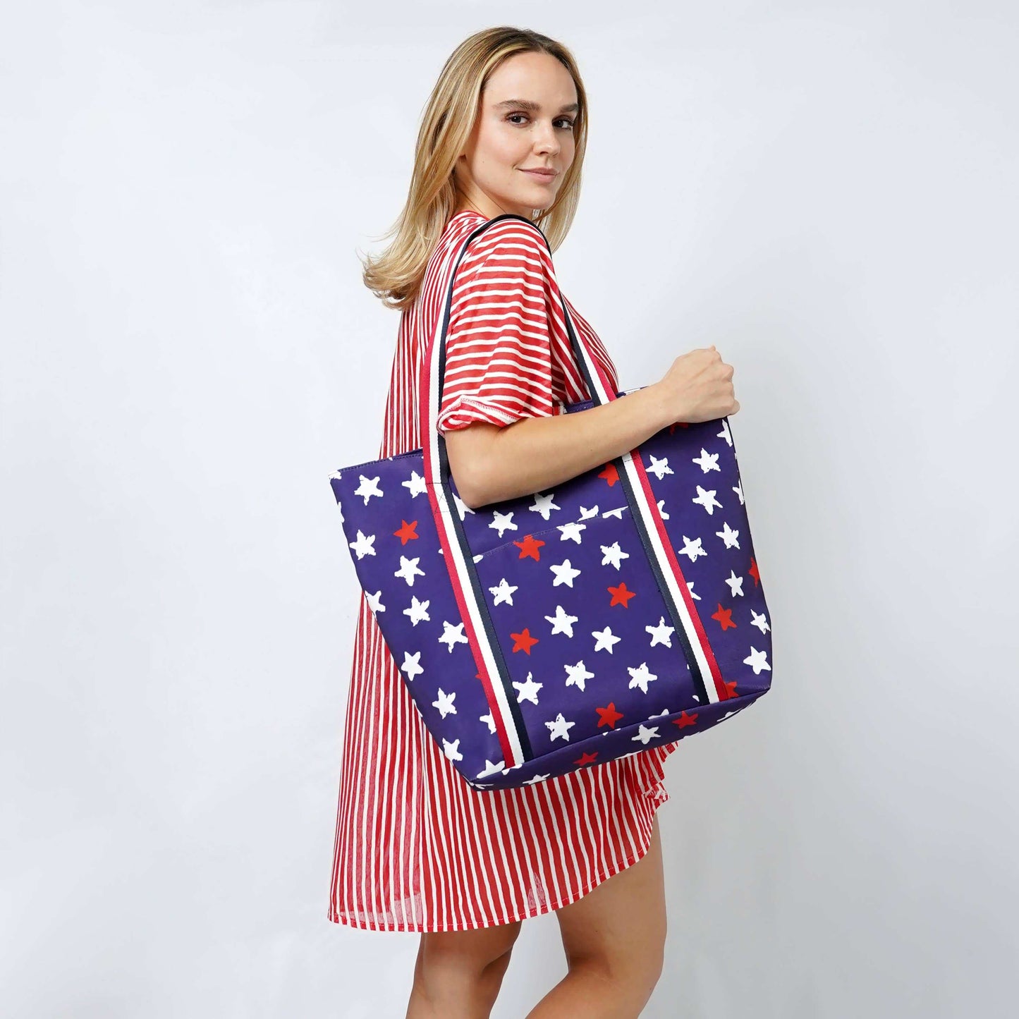 American Flag Print Summer Tote BagAmerican Flag Print Tote Bag 

- Zipper Closure
- One Small Zipped Pocket Inside
- Size: 15.25" L x 19" W (5.5" Wide Bottom)
- 100% Polyester

**Light Weight, PerfecAmerican Flag Print Summer Tote BagFashion CityScrub Angel & Accessories 